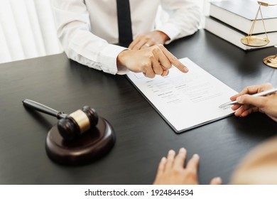 Lawyer Discuss The Contract And Legal Document Agreement In Office. Law And Legal Concept