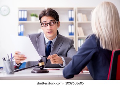 Lawyer discussing legal case with client - Shutterstock ID 1039658605