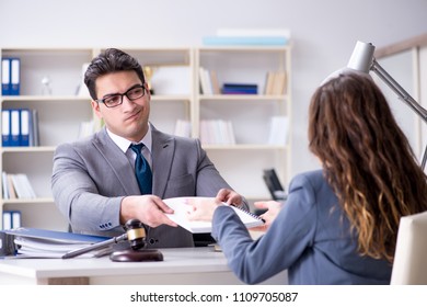 Lawyer discussing legal case with client - Shutterstock ID 1109705087