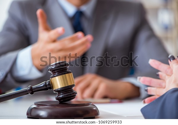 Lawyer discussing legal\
case with client