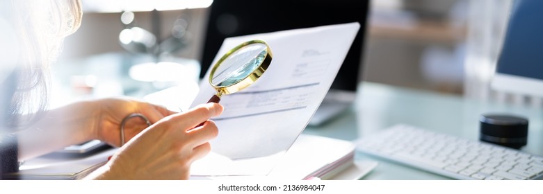 Lawyer Examining Paper Using Magnifier Glass. Tax Fraud Investigation