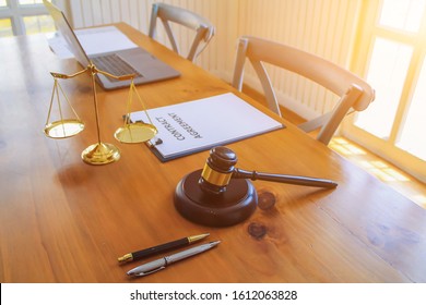 The Lawyer Is Giving Legal Advice To Investors And Discussing Legal Contract Documents To Be Used As A Contract Between Investors Signing A Consent To Invest In Doing Business Together.