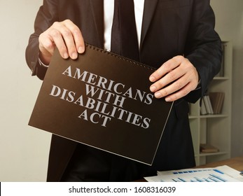Lawyer Holds Americans With Disabilities Act ADA Book.