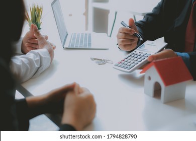 lawyer insurance broker consulting giving legal advice to couple customer about buying renting house. financial advisor with mortgage loan investment contract. realtor selling real estate property - Shutterstock ID 1794828790