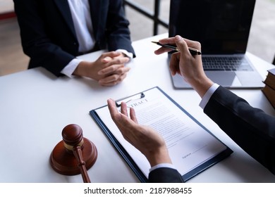 Lawyer or judge advising client's trial at attorney's office, litigation counseling ideas with lawyers. - Shutterstock ID 2187988455