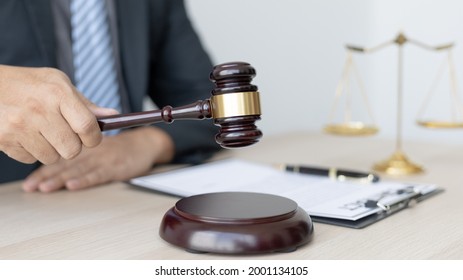 Lawyer or judge holding Hammer prepares to judge the case with justice, Legal consulting services and  litigation, scales of justice, law hammer, Concept of litigation and legal services - Shutterstock ID 2001134105