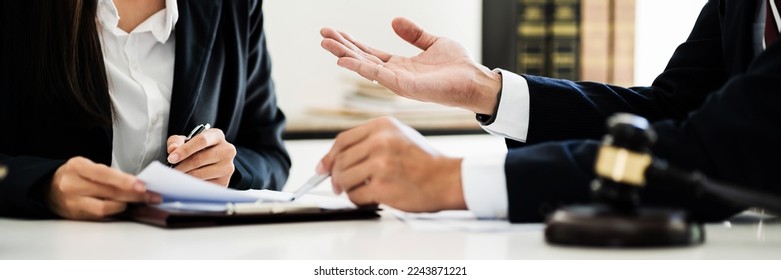 Lawyer with lawsuit meeting with client discussing with contract agreement at courtroom. - Shutterstock ID 2243871221