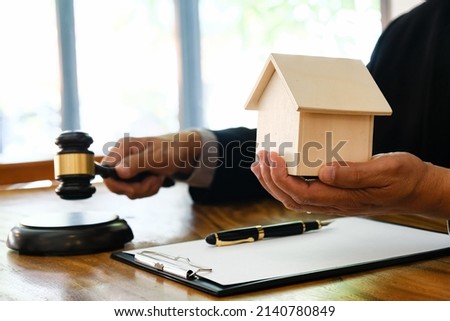 Lawyer Legal counsel presents to bid sale judgment mallet with judge
Real estate auction bid property sale judgment with Gavel 