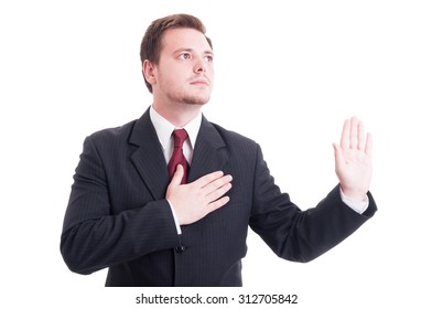 Lawyer Making Oath Or Swearing Gesture With One Hand On The Heart And The Other One Up