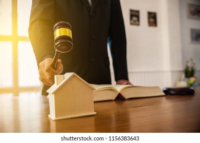 Lawyer Mediating In A Property Dispute .Auctioneer Knocking Down A Property Sale.Real Estate Sale Auction Concep.