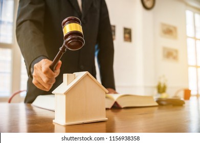 Lawyer Mediating In A Property Dispute .Auctioneer Knocking Down A Property Sale.Real Estate Sale Auction Concep.