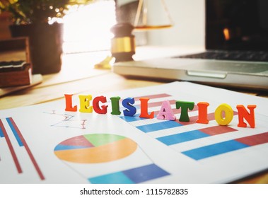 Lawyer object with text display on wooden table desk and laptop.
