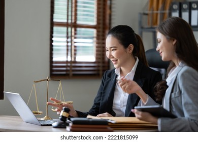 Lawyer Office. Statue Of Justice With Scales And Lawyer Working On A Laptop. Legal Law, Advice And Justice Concept.