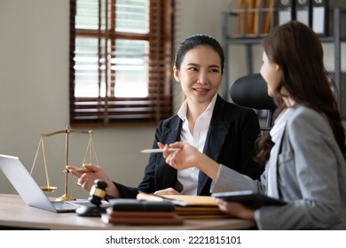 Lawyer Office. Statue Of Justice With Scales And Lawyer Working On A Laptop. Legal Law, Advice And Justice Concept.