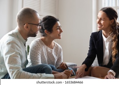 Lawyer Provide Help To Multiracial Couple. Family Purchasing Realestate Sign Contract Affirm Buy Sell Legal Paper, Got Lease In Bank, Realtor And Rental Property, Client And Businesswoman Meet Indoors