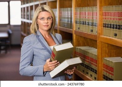Lawyer reading book in the law library at the university