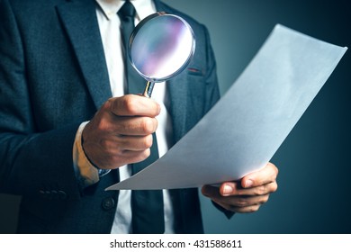 Lawyer Reading Legal Contract Agreement Disclaimer With Magnifying Glass