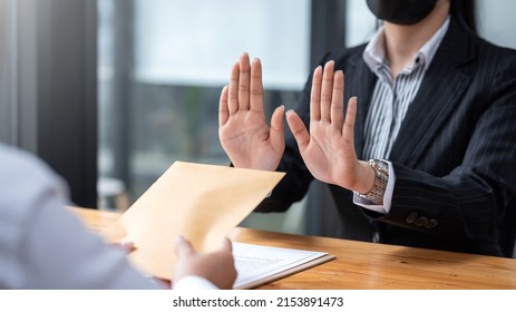 Lawyer refuses to accept bribe from business people in contracting. Corruption and anti bribery concept. - Shutterstock ID 2153891473