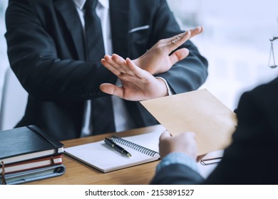 Lawyer refuses to accept bribe from business people in contracting. Corruption and anti bribery concept. - Shutterstock ID 2153891527