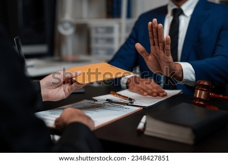 Lawyer refuses to accept bribe from business people in contracting. Corruption and anti bribery concept. Foto stock © 