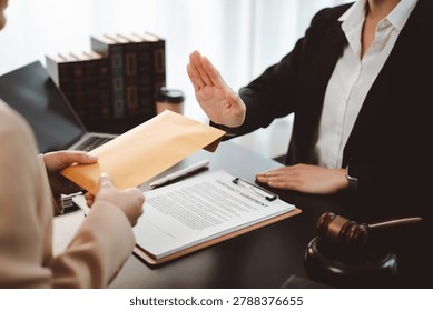 Lawyer refusing to accept a brown envelope filled with undisclosed cash from a client, demonstrating strong ethical principles, honesty, and a commitment to justice against bribery