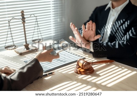Lawyer is refusing a bribe from a client in their office