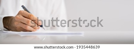 Lawyer Signing Business Contract Document At Meeting