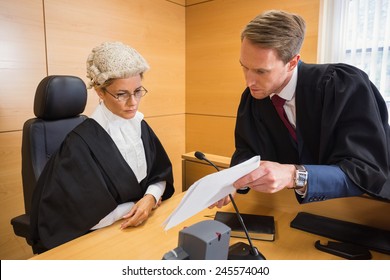 Lawyer Speaking With The Judge In The Court Room