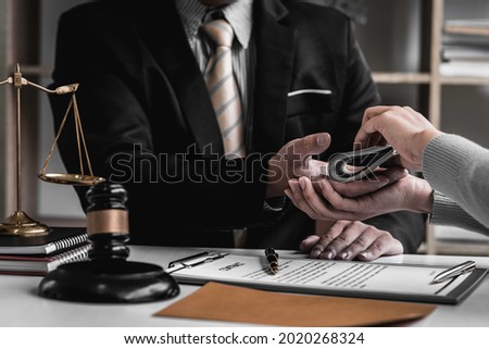 lawyer taking dollar bribe from the female client for falsifying documents, businessman taking bribes corruption illegal fraud bribery concept. Foto stock © 