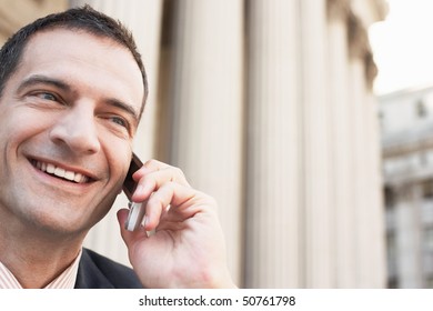 Lawyer Using Mobile Phone Outside Courthouse