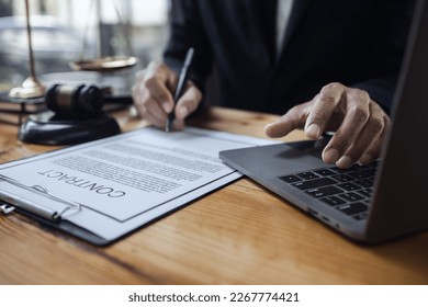 lawyer working with contract agreement at table office, law and justice concept, Selective focus. - Shutterstock ID 2267774421