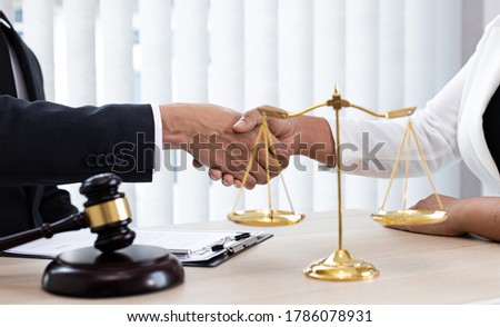 Lawyers or counselors join hands with clients to congratulate the end of the case by the company, Negotiation or settlement of lawsuits concept. Stock foto © 