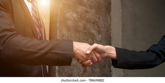 Lawyers handshake,Attorneys from a law firm provide confidence to clients and promise to win cases,Justice Legal Concepts,Lawyer from Law firms with Justice Legal Concepts.Clients is trust in team.

