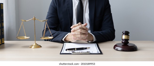 Lawyers Or Judges Sign Documents In Accordance With Legal And Fair Terms Of Agreement, Legal Ethics And Integrity, Scales Of Justice, Law Hammer, Litigation And Legal Services.