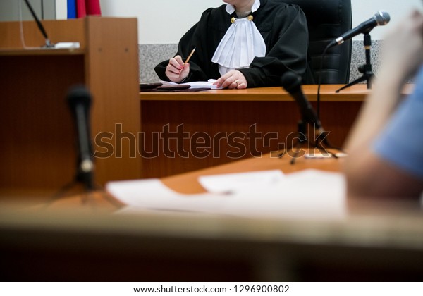 Lawyers\
listening to the judge in the court\
room