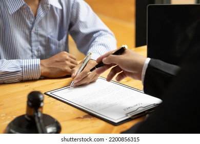 Lawyer's Signing Of The Contract Documents The Legal Action Agreement.