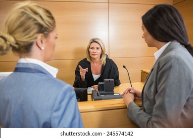 Lawyers Speaking With The Judge In The Court Room