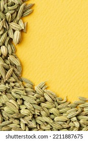 Lay Of Green Fennel Seeds On Yellow Textural Background. Traditional Aromatic Seasoning And Ingredient Of Ayurvedic Food