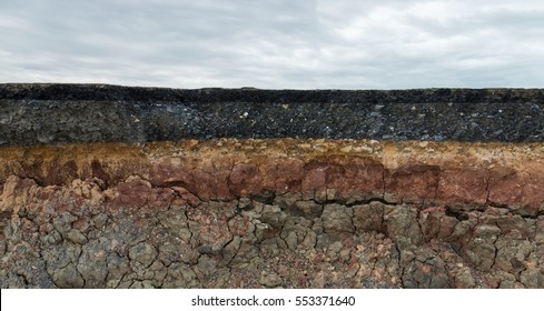 The layer of asphalt road with soil and rock. Un-focus image. - Shutterstock ID 553371640
