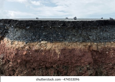 The layer of asphalt with soil and rock. Un-focus image. - Shutterstock ID 474553096