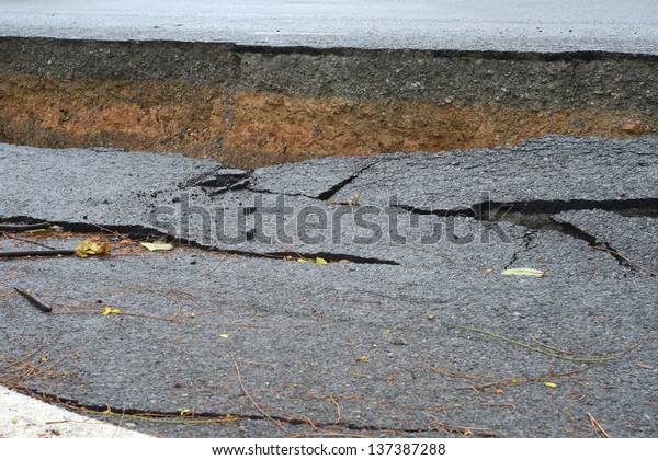 layer of broken\
asphalt road at rural\
areas.