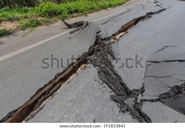 layer of broken\
asphalt road at rural\
areas