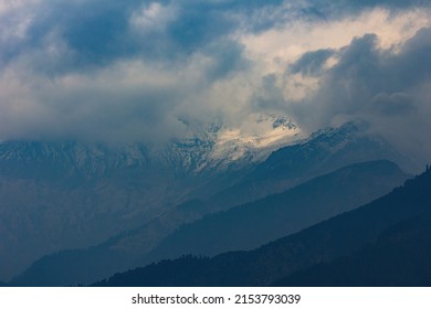 Layer of the mountain and dark cloud cover the snow mountain at Poonhill, Nepal