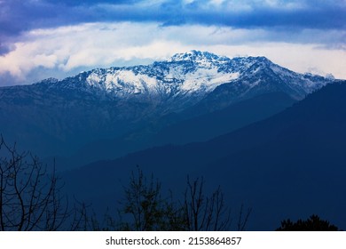 Layer of the mountain and dark cloud cover the snow mountain at Poonhill, Nepal