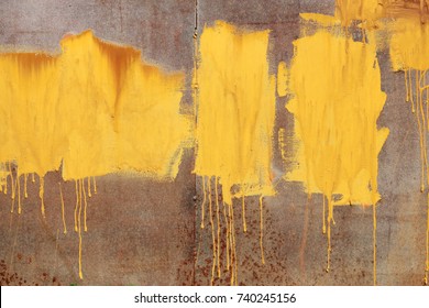 Layer Paint With Streaks Of Stains On Iron. Yellow Background. Ocher Embossed Texture. Fluid Paint Base. Inundations, Trickles Of Amber Paint, Spots Of Various Shapes On Metal Surface. Rust, Corrosion