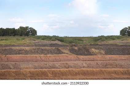 layer of soil when digging underground Show the color of each layer and the texture of each layer of soil. - Shutterstock ID 2113922330