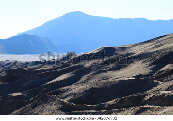 Layer Volcanic ash as sand ground\
of Mount Bromo volcano the magnificent view of Mt. Bromo located in\
Bromo Tengger Semeru National Park, East Java,\
Indonesia.
