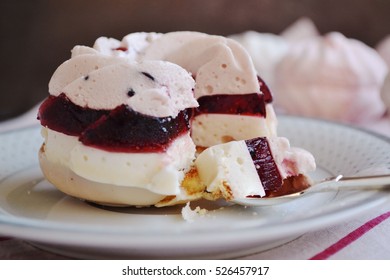 Layered Dessert - Delicate Souffle And Fruit Marmalade On Pastry Bathed In White Chocolate. Festive Cake With Currant Flavor, In The Form Of Rings.