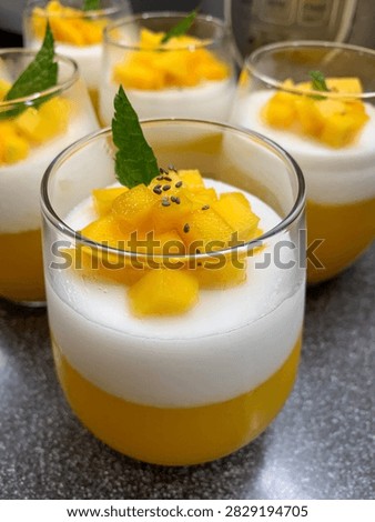 Layered mango coconut dessert cups  that look fresh, tropical, and restaurant-worthy.