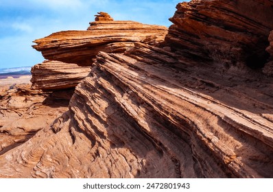 Layered weathered red sandstone rock formations, Jurassic sedimentary rocks in the Arizona desert near Glen Canyon, USA - Powered by Shutterstock